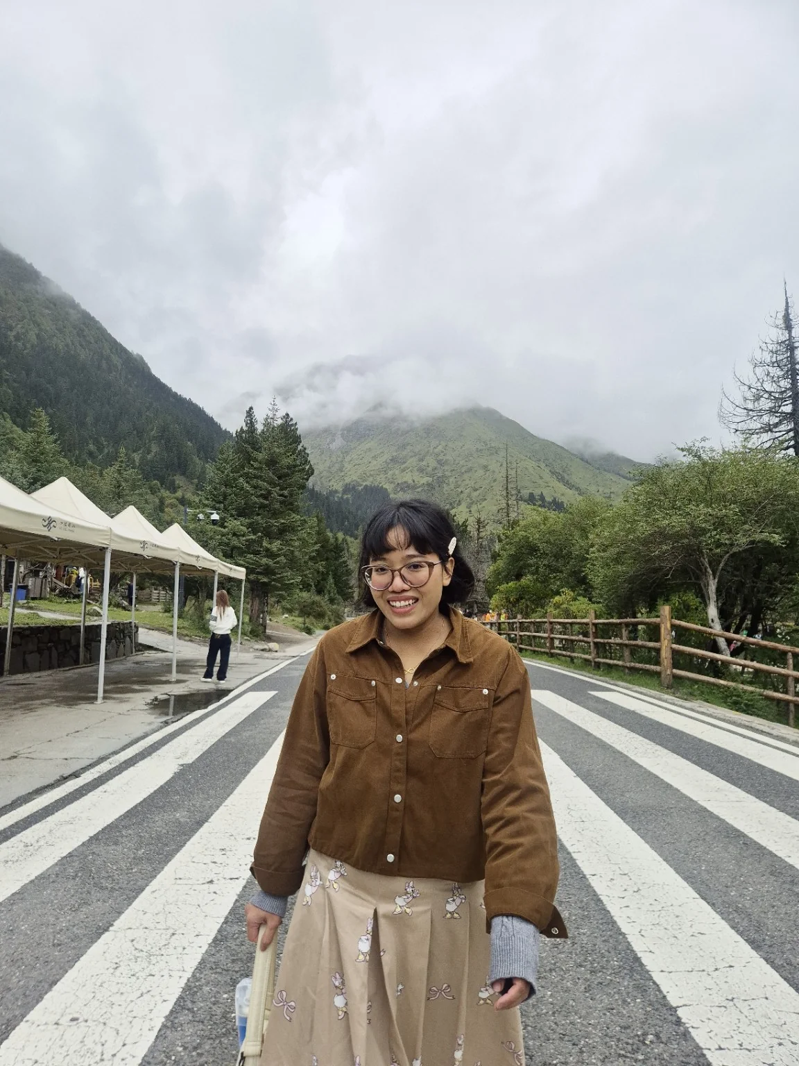 Mazwani smiling on a mountain road